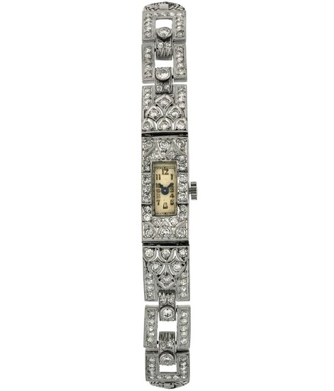 Unsigned. Fine, white gold and diamonds lady's wristwatch with gold integrated bracelet. Made circa 1920