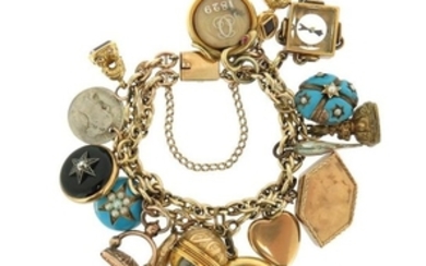 A gold charm bracelet, suspending assorted charms …