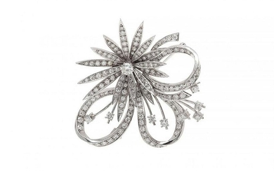 18 kt white gold pin brooch. in the shape of a flower with a bow with a central diamond, brilliant