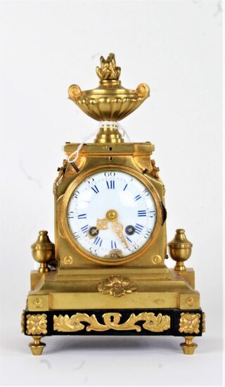 19th Century French gilt brass mantel clock, the flame urn finial top above a stepped case and stile