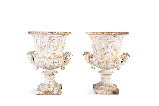 A PAIR OF 19TH CENTURY CAST IRON URNS,...