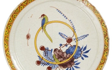 40-Delft: a polychrome earthenware plate depicting a bird perched on...