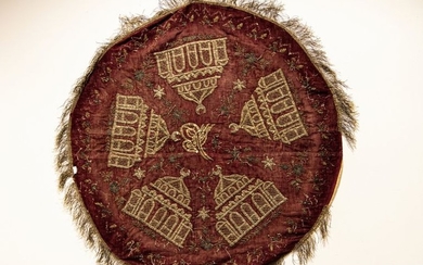 A Circular deep purple textiel bohca