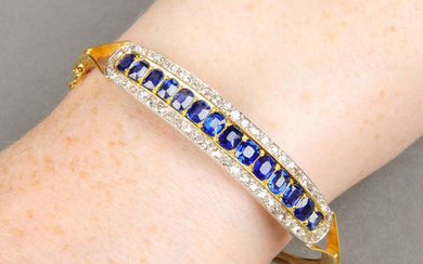 A late Victorian 15ct gold sapphire and diamond hinged bangle.