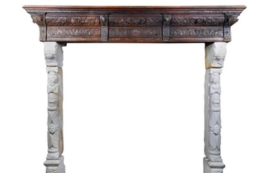 A 18th century stone and carved oakwood fireplace…