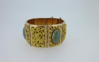 A panel bracelet set with jadeite jades