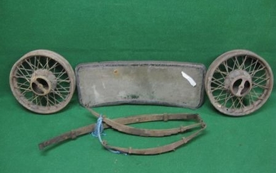 Possibly Morris 8 windscreen and two wire wheels together with three different leaf springs