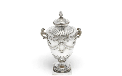 A silver cup and cover