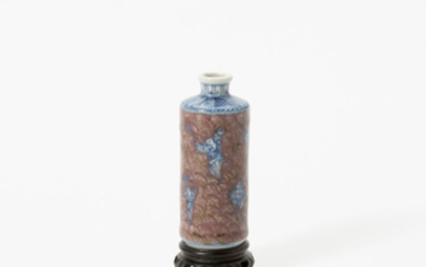 A small Chinese blue and white and copper-red-glazed rouleau vase