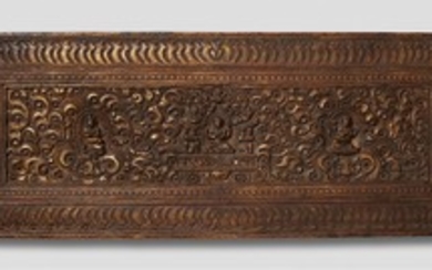 A Tibetan gilt wood manuscript cover. 17th/18 ...