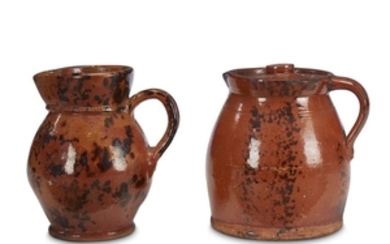Two glazed redware jugs 19th century Each with manganese...