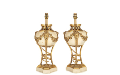 A pair of early 20th century gilt bronze and white marble vase lampbases