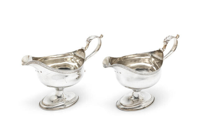 A pair of George III silver sauceboats