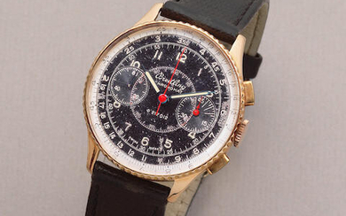 Breitling. An 18K gold manual wind chronograph wristwatch