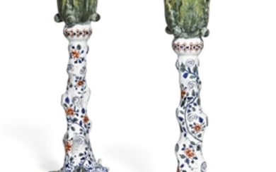 A pair of Dutch Delft polychrome candlesticks, late 18th century