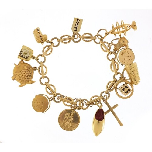 9ct gold charm bracelet with a selection of mostly gold char...