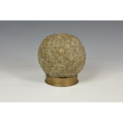 A 17th / 18th century carved granite cannonball, 15cm. diame...