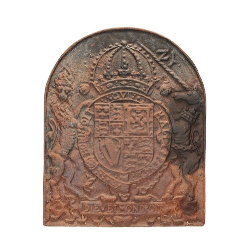 A 17th century cast iron fireback The arched back with the S...