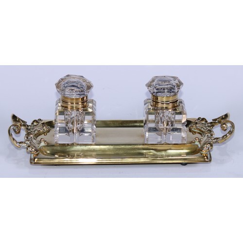 A 19th century gilt-brass partner's inkstand, the rounded re...