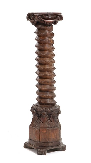A 20th century dark stained and carved wood column. H. 158. W. 40. D. 40 cm.