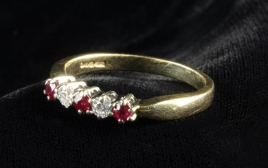 A 9 Carat Gold Ring set with two diamonds between three rubies.