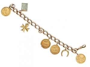 A 9ct gold charm bracelet, suspending four...