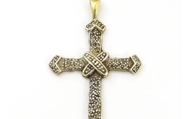 A 9ct gold pendant of cross form with chip set diamonds. App...