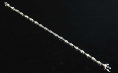 A 9ct white gold diamond set line bracelet