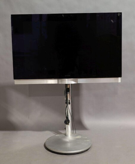A Bang & Olufsen Beovision 7 television, with stand, no remote It is the buyer's responsibility to ensure that electrical items are professionally rewired for use. (VAT charged on the Hammer price)