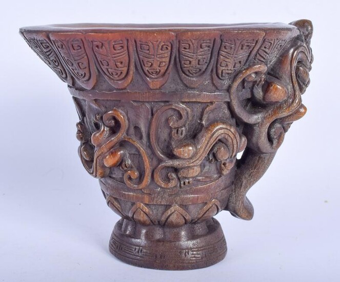 A CHINESE CARVED BUFFALO HORN STYLE LIBATION CUP