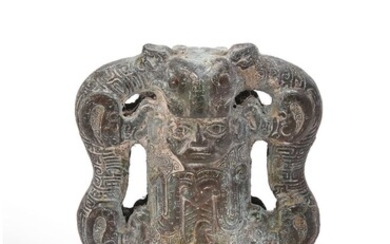 A Chinese bronze two-sided chariot fitting