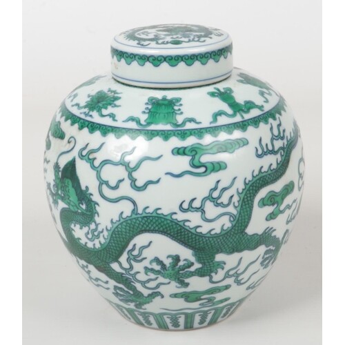 A Chinese ginger jar and cover. Painted in underglaze blue a...