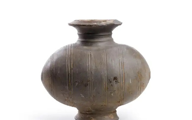 A Chinese small cocoon jar Western Han dynasty decorated with eight bands...