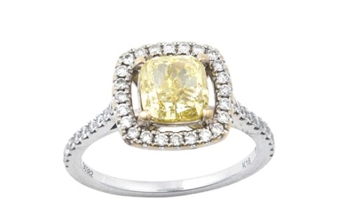 A Diamond Cluster Ring the fancy intense yellow cushion cut...