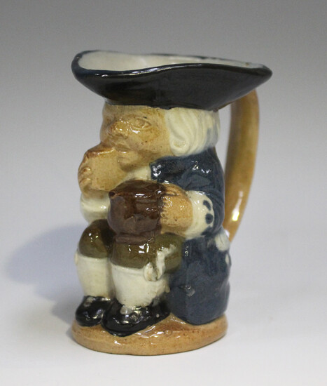 A Doulton Lambeth stoneware miniature Toby jug, circa 1900, designed by Harry Simeon, height 8cm.
