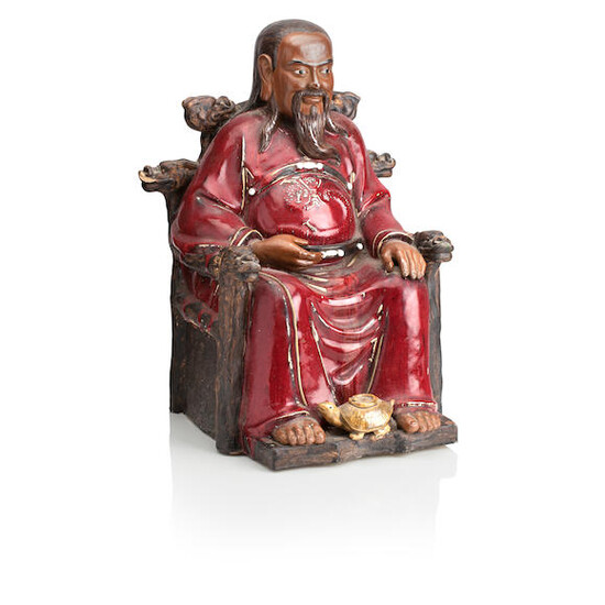 A EARLY 20TH CENTURY CHINESE RED GLAZED TERACOTTA FIGURE OF A GENTLEMAN