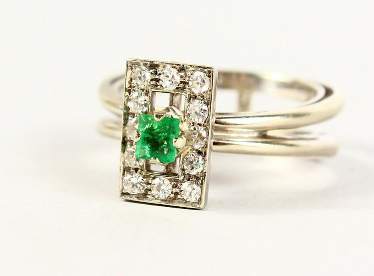 A GOOD 18CT GOLD, EMERALD AND DIAMOND DESIGNER RING.