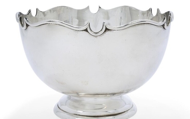 A George V silver Monteith-style punch bowl, Birmingham, 1935, Barker Brothers, of plain circular form with shaped rim and raised on a stepped circular foot, 16cm high, 24.8cm dia., approx. weight 30.3oz