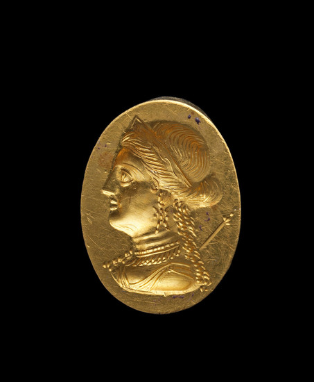 A Greek gold ring with a portrait bust of a Ptolemaic Queen
