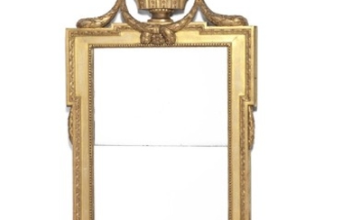A Gustavian giltwood mirror. Sweden, c. 1777. H. 158 cm. W. 70 cm.