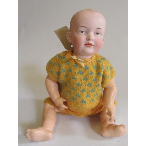 A Kley & Hahn bisque socket head baby doll with painted eyes...