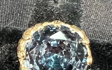 A LONDON BLUE TOPAZ SET IN A NEW 14 KT YELLOW RING