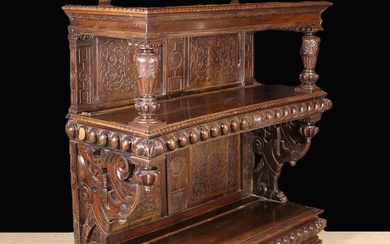 A Large Italian Renaissance Style Carved Oak & Walnut Two Tier Buffet. The moulded top (with third t