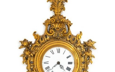 A Louis XV Style Brass Cartel Clock
