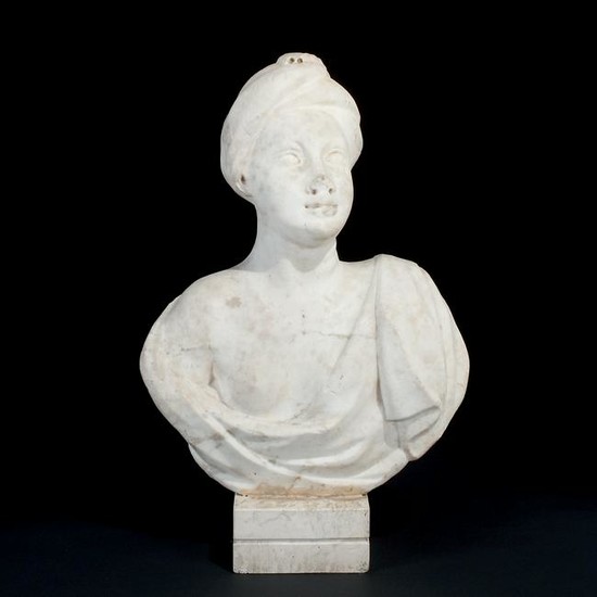 A Roman white marble female bust with a turban