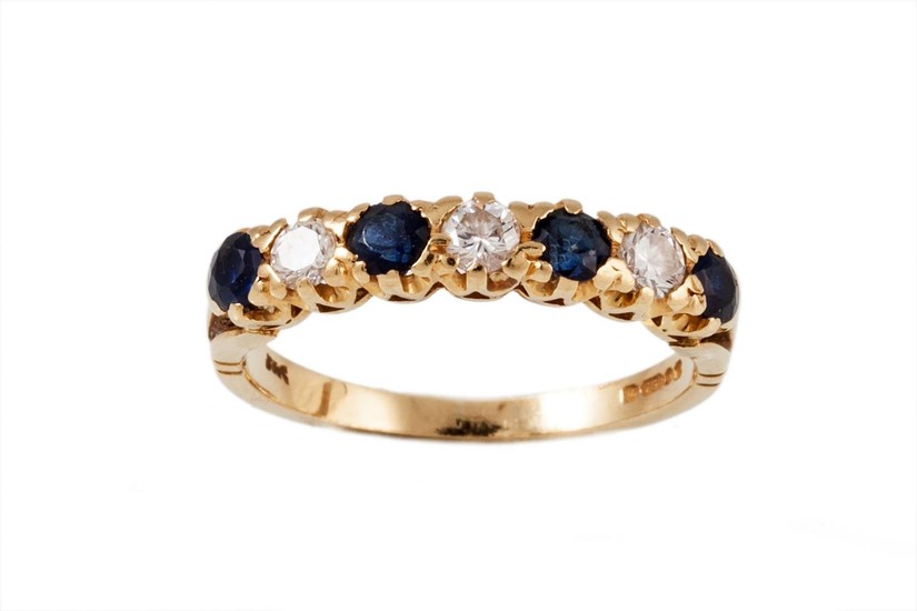 A SEVEN STONE DIAMOND AND SAPPHIRE RING, mounted in yellow g...