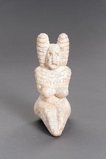 A STONE INDUS VALLEY STYLE FIGURE OF A GODDESS
