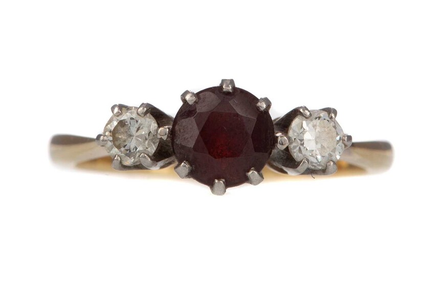 A SYNTHETIC RUBY AND DIAMOND THREE STONE RING