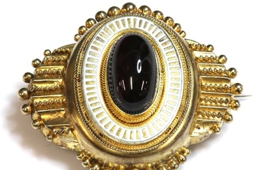 A Victorian Etruscan Revival gold, garnet and enamel, shield form brooch, c.1860