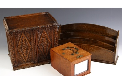 A Victorian carved oak stationery cabinet, the two doors ope...